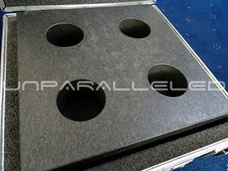 Precision ceramic tooling plate with drilled vacuum holes packed in a transport case